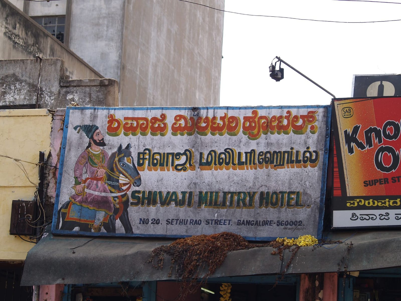 Shop sign in Bangalore written in Kannada, Tamil and English