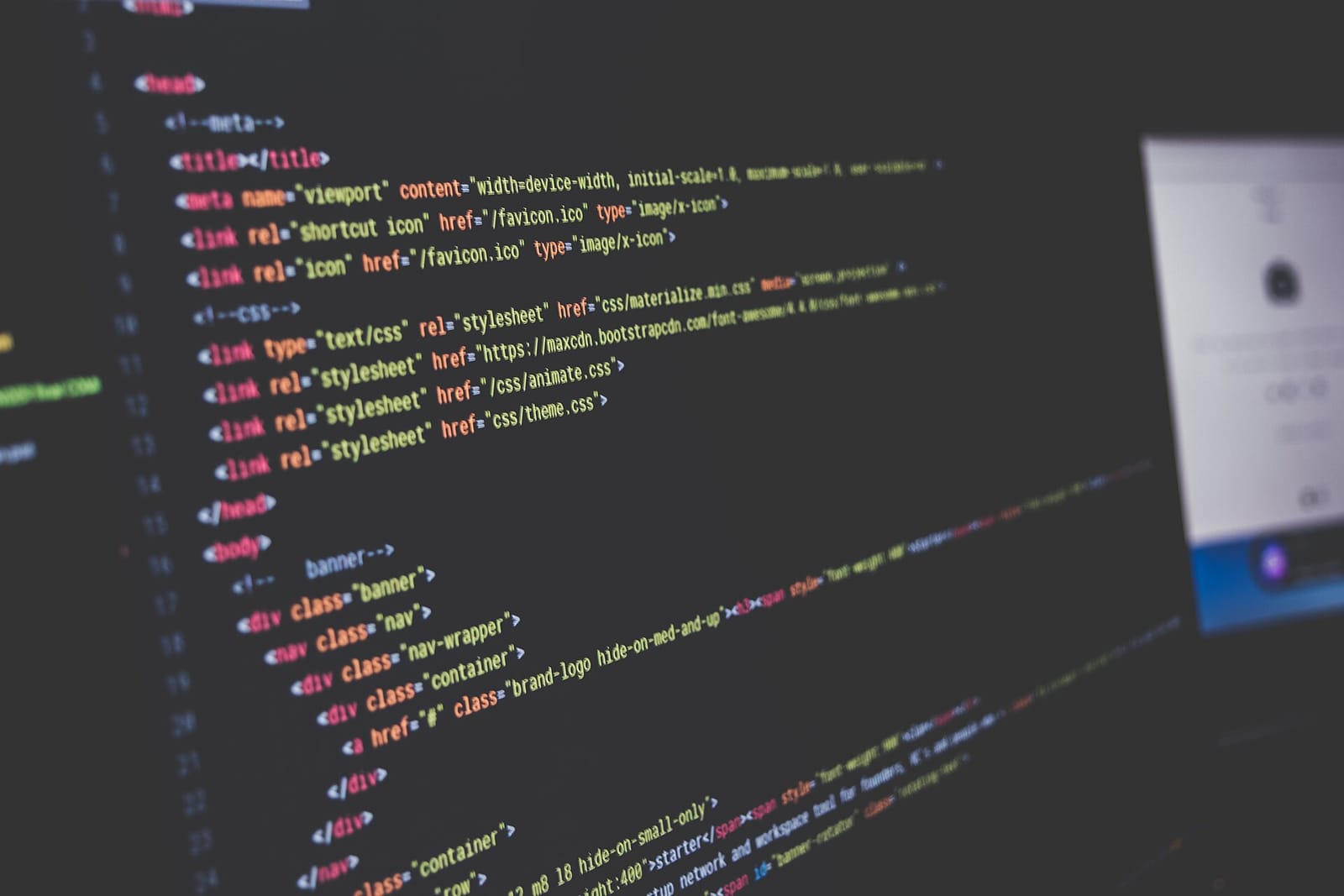 Lines of colour-highlighted HTML code on a dark editor screen