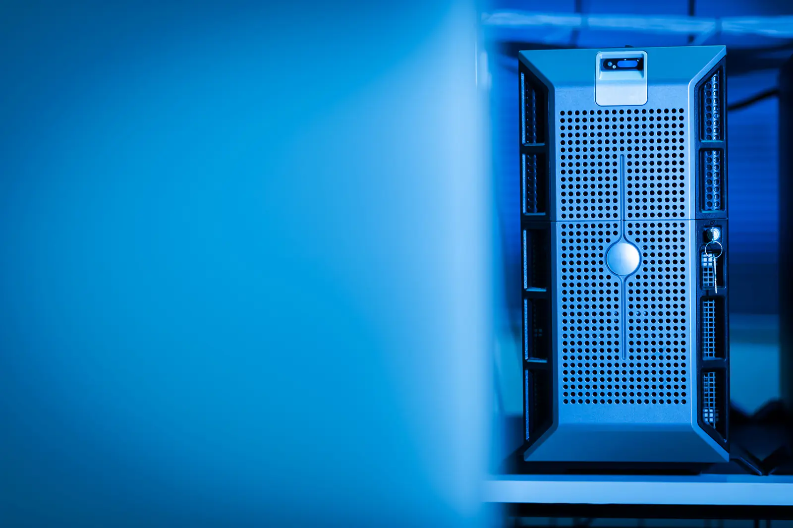 A server unit with blue lighting in a data center room