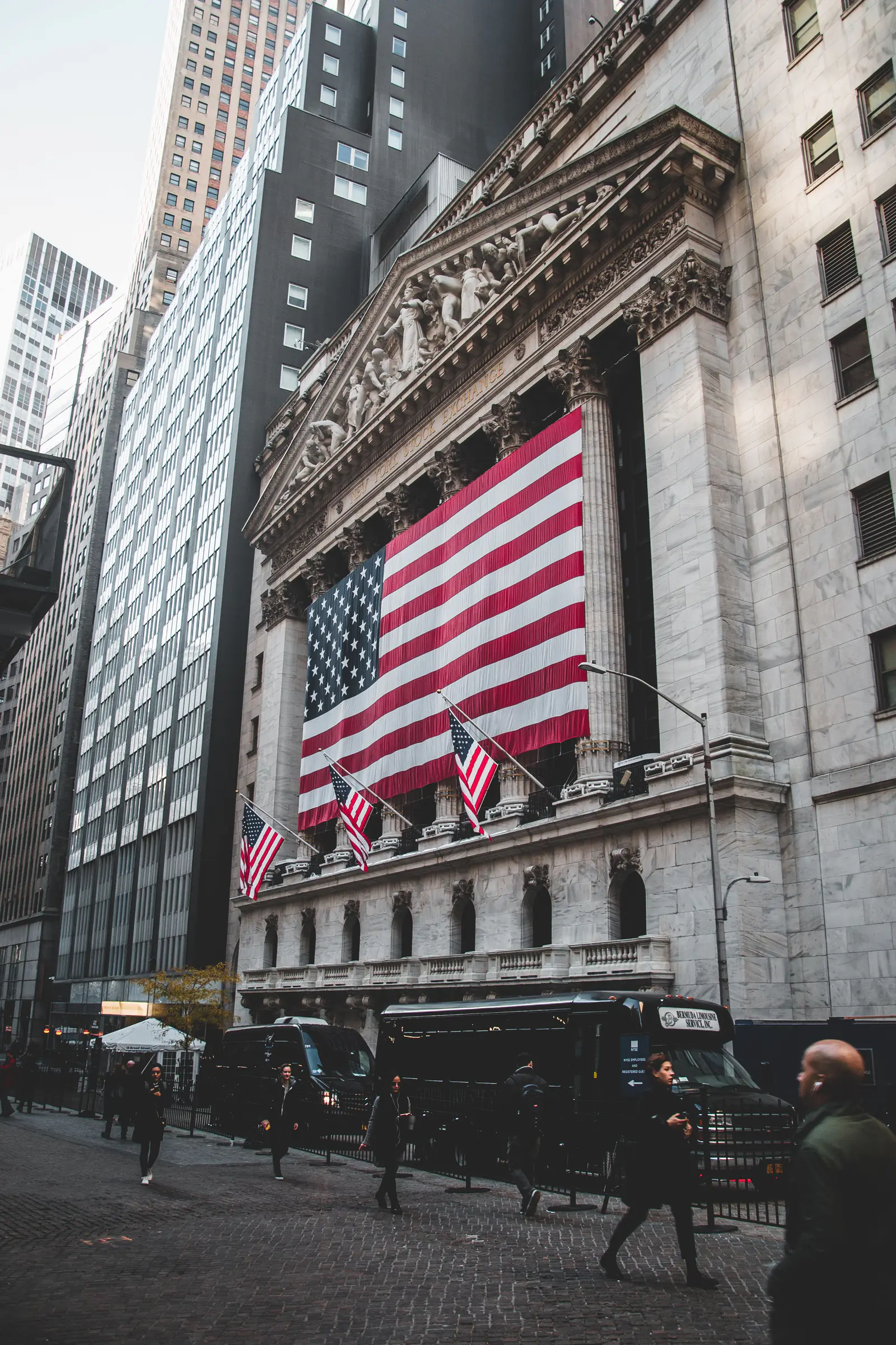 American flags hanging on the facade of the New York Stock Exchange building