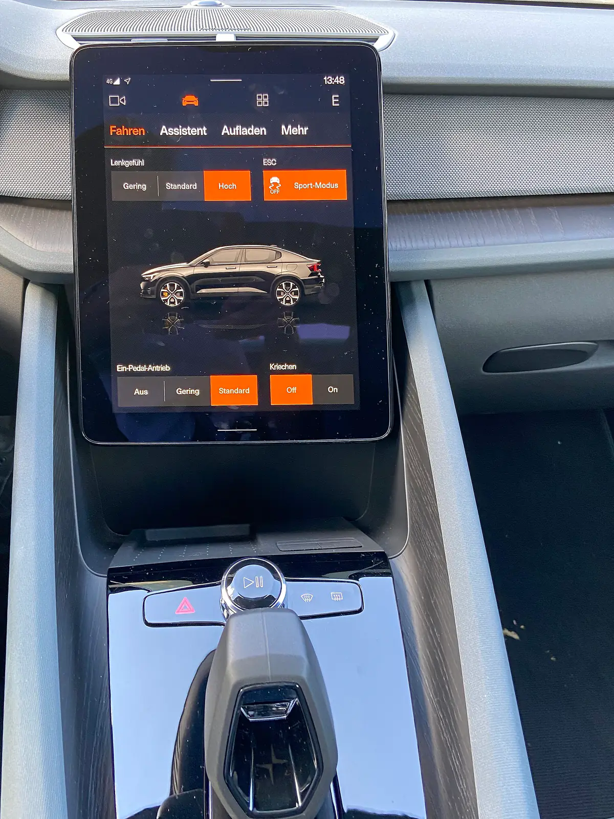 The portrait-format central touchscreen in the dashboard of a Polestar 2, above the gear selector