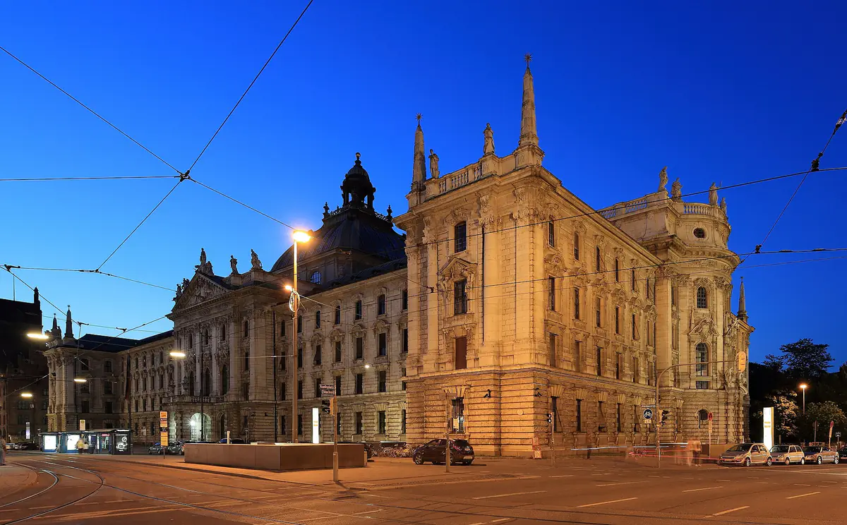 The domed Palace of Justice building in Munich lit up at dusk