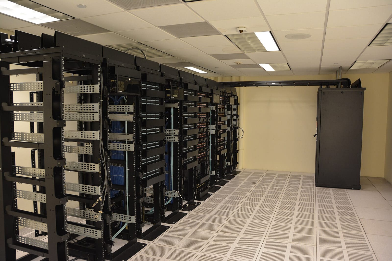 Rows of server racks in a data center room