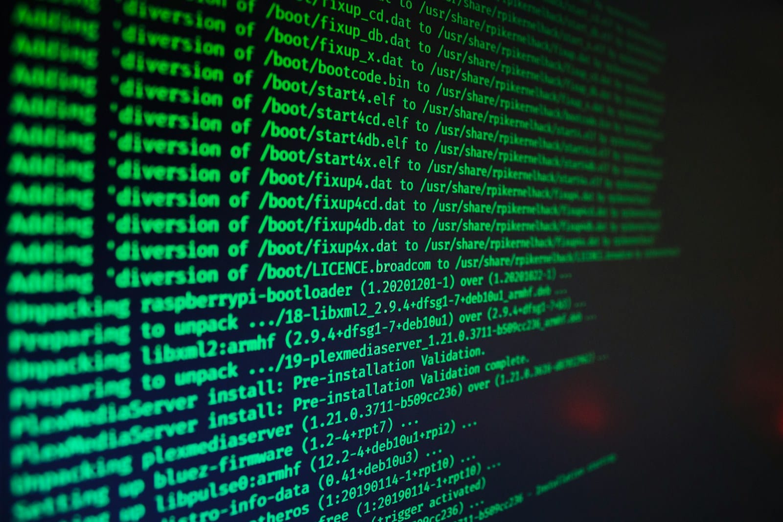 Green terminal text scrolling on a dark computer screen